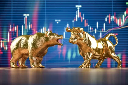 Image of Golden bull and bear on stock data chart background. 