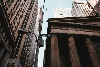 Photo of the wall street sign in NYC in front of the New York Stock Exchange